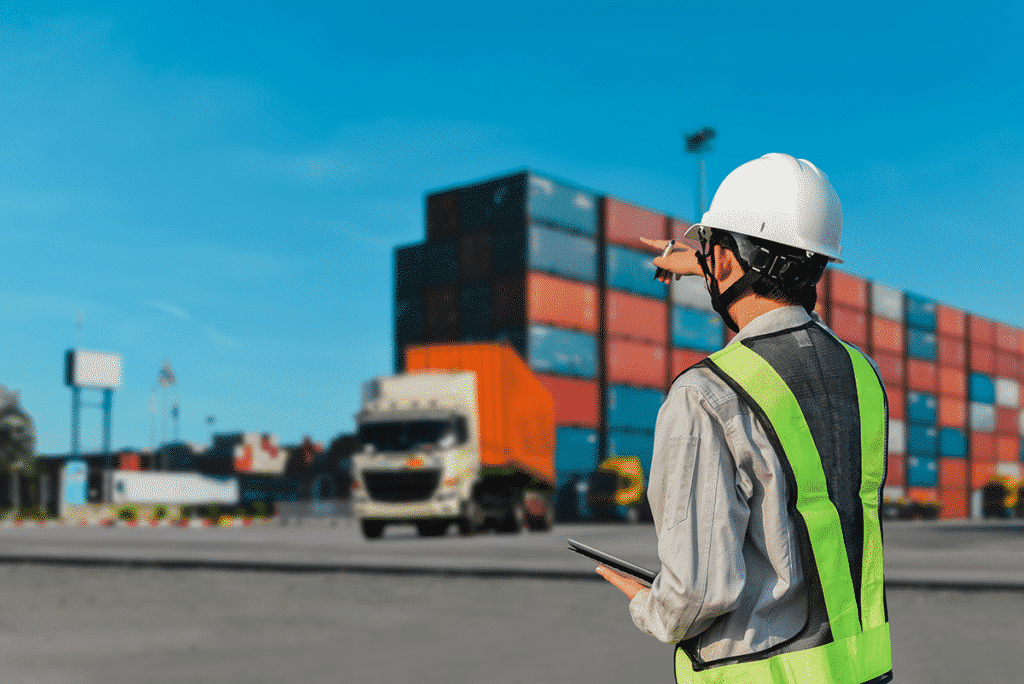 Worker instructing shipping fleet utilizing information on tablet