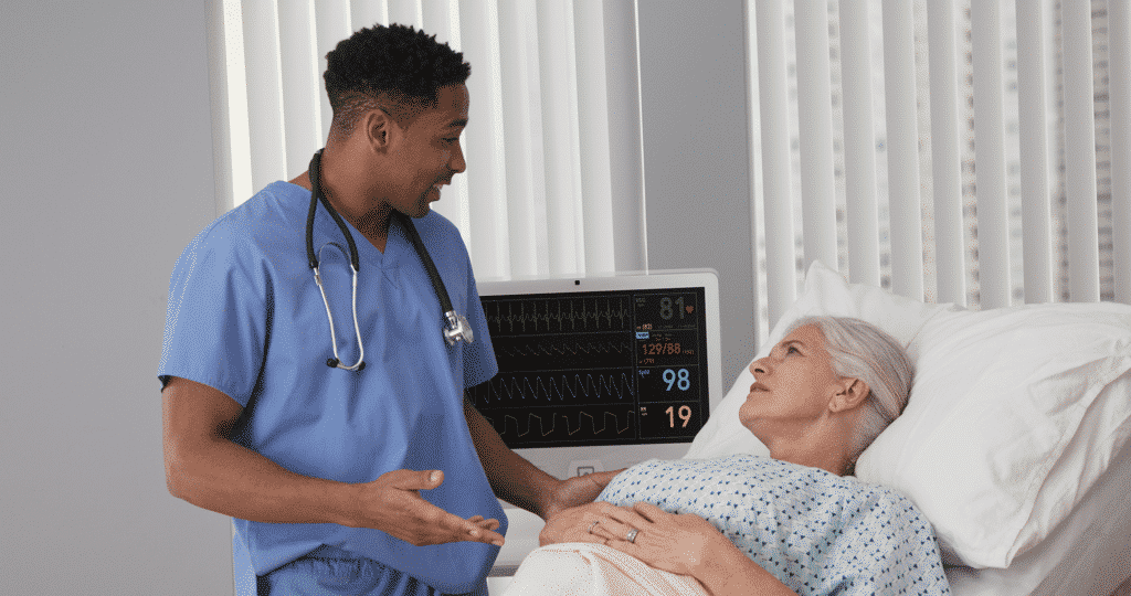 Doctor showing patient charts on panel pc