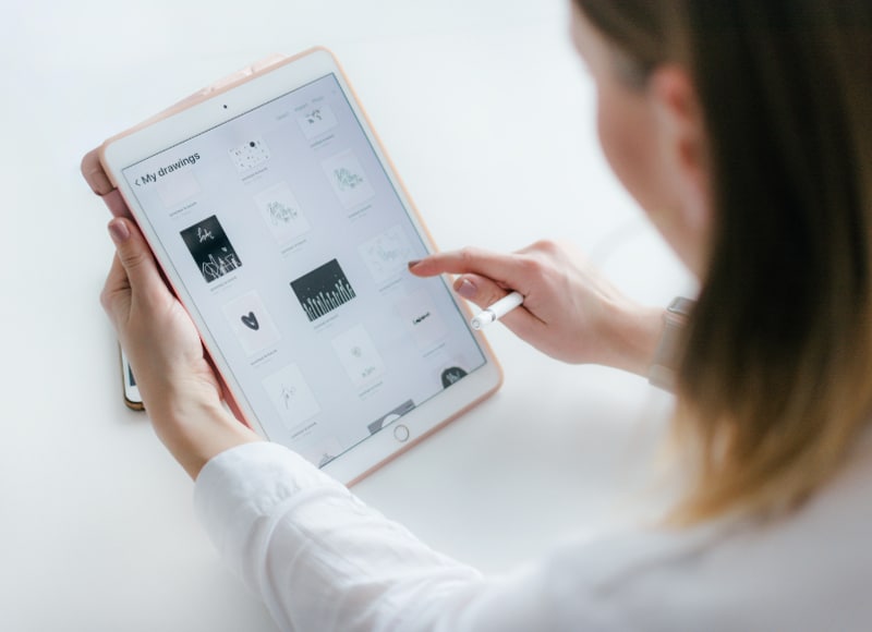 Woman Reading Tech Blog on a Tablet