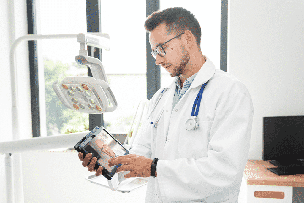 Doctor conferencing with a patient on a tablet